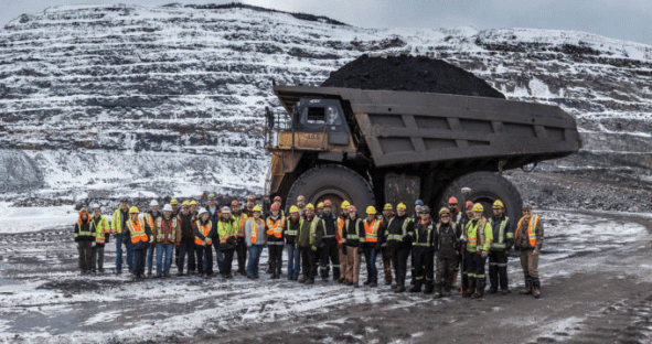 Conuma Coal crew in front of haul truck